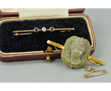 TWO EARLY 20TH CENTURY BROOCHES to include a 9ct gold bar brooch set with a sapphire, diamond and ruby, all within millegrain