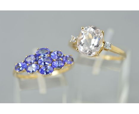 TWO GEM SET DRESS RINGS comprising of a three stone pale pink kunzite ring, ring size S, a 9ct gold tanzanite multi stone ova