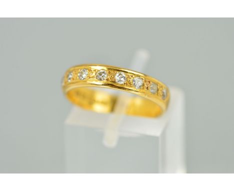 A 22CT GOLD DIAMOND HALF ETERNITY RING, the plain band set with nine single cut diamonds, estimated total diamond weight 0.35