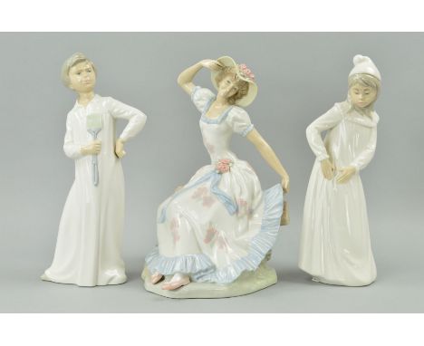 TWO NAO FIGURES, girl with torn nightgown, approximate height 29.5cm and boy in nightgown with fly swatter, approximate heigh