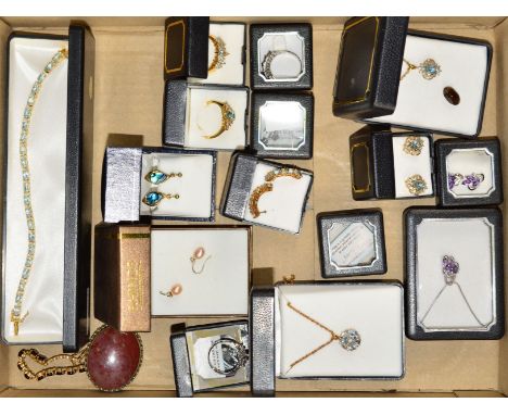 A SELECTION OF GEM JEWELLERY to include topaz pendants, earrings, rings and a bracelet, a matching amethyst pendant, ring and