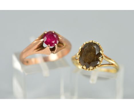 TWO GEM SET RINGS, the first a 9ct gold ring claw set with an oval smokey quartz, hallmarked, ring size M, the second a circu