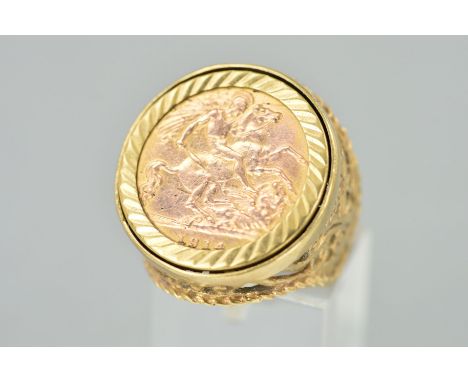 A GOLD HALF SOVEREIGN RING, the half sovereign dated 1914, within a diamond cut pattern surround, to the fancy ring mount wit