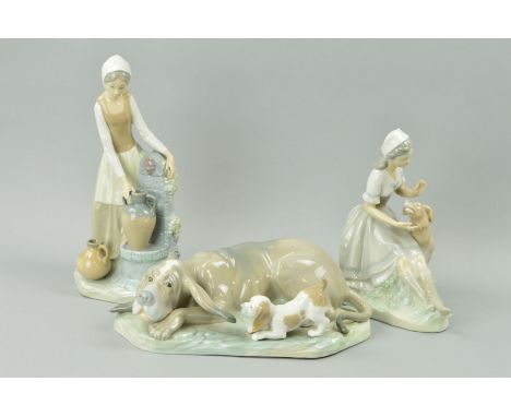 THREE LARGE NAO FIGURES/GROUPS to include Hound dog with puppy, length 29cm, woman at well and seated young woman with dog (3