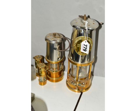 AN ECCLES PROJECTOR MINERS LAMP, type 6, with a smaller Hockley Lamp and Limelight lamp and two smaller ornamental brass mine