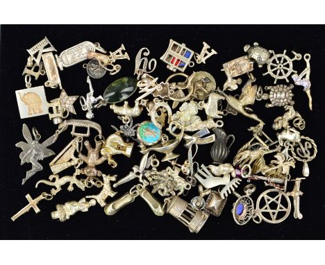 A SELECTION OF LOOSE CHARMS to include a hinged bookcase, an enamelled St Christopher, a lantern, a harp etc, many with marks