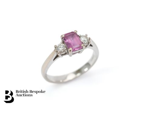 18ct white gold pink sapphire and diamond ring. The ring set with an emerald-cut pink sapphire measuring 7 x 5mm, with 0.28 c