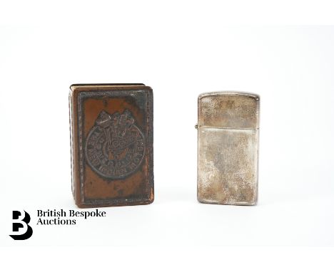 An interesting matchbox cover relating to the Indian Motorcycle Company, together with a sterling silver Zippo lighter. (2)