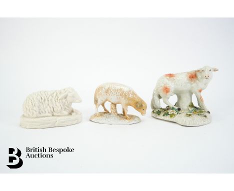 A Derby model of a lamb resting against a trunk, circa 1765, cream glaze, heightened with red sponge, painted features, appro