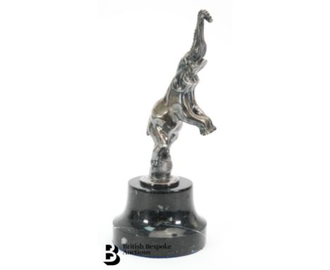A well detailed Bugatti elephant mascot, believed to have been produced in the 1960s, mounted to a marble display base, appro