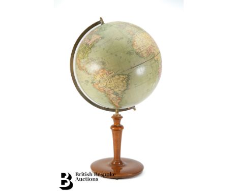 An early 20th century globe, Jordglob Stockholm Svenska Bokhandelscentralen A.B:s on turned stand, measures approx. 60cm h.