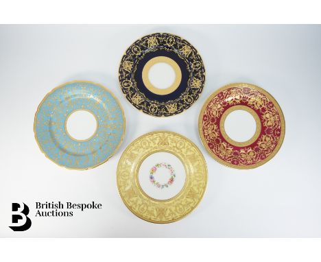 Four William Guerin &amp; Co Limoges gold-encrusted service plates, including a cobalt blue, turquoise blue, ruby and canary 