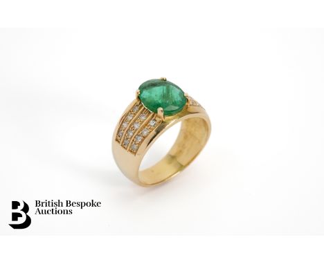 An 18ct yellow gold 3ct natural emerald and diamond ring. The oval emerald measures approx. 12 x 8mm, set with three rows of 
