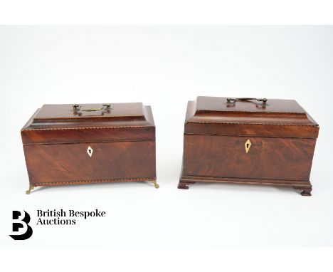Two Victorian mahogany tea caddy. The lid opens to reveal three compartments, with decorative stringing on brass lion claw fe
