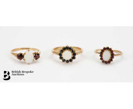 9ct gold opal and sapphire ring, the ring set with an opal 6mm, size O; 9ct gold opal and garnet ring, the ring set with an o