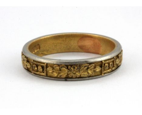 A 22ct yellow and white gold ring, (K.5).&nbsp;Weight. 4.5g.