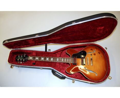 A Tanglewood TSB59 DLXHB honey blonde electric guitar with Hiscox case.