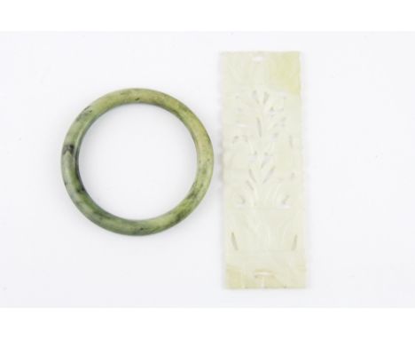 A Chinese carved jade box panel and a nephrite jade bangle, bangle Dia. 6cm, panel L. 12.5cm.