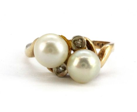 A 10ct yellow gold (stamped 14k) ring set with pearls and diamonds, (K).