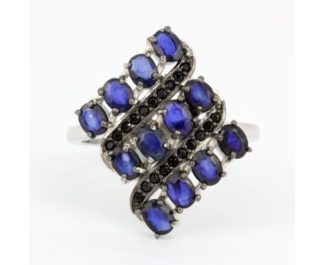 A 925 silver ring set with oval cut kyanites and black spinel, (R).