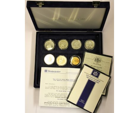 A case containing six silver commemorative coins and one Chinese commemorative coin.