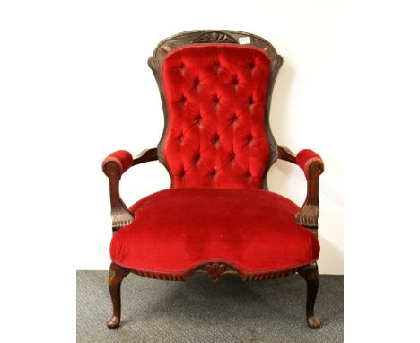 A button back red upholstered armchair, H. 90cm.
