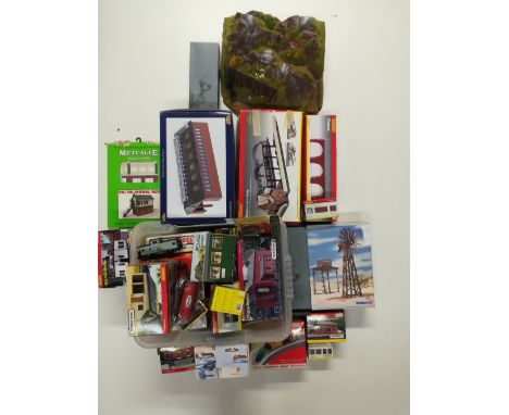 A large quantity of 00 gauge Hornby, Bachmann and Schleich boxed accessories; buildings, tunnels, bridges, etc.