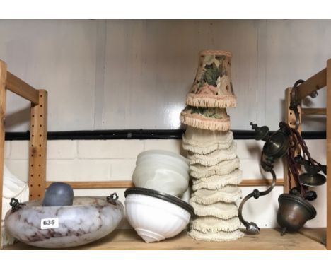 A quantity of lamps and lamp shades.