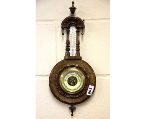 A small carved barometer, L. 43cm.