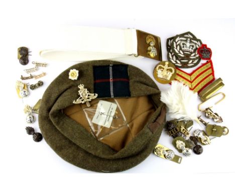 A First World War Scottish army cap with belt and various badges.