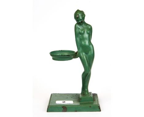 A 1920's Art Deco green painted metal figural tea light holder, H. 21cm.