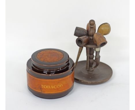 A smoker's wooden stand with five vintage pipes together with a round ceramic tobacco box H12cm. (7)