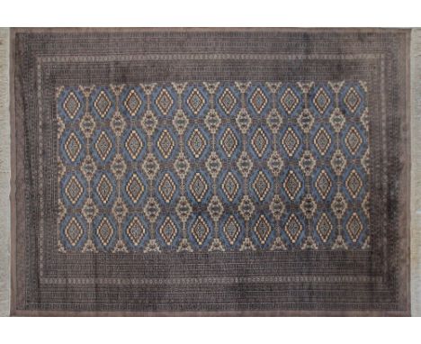 A Bokhara wool carpet, with geometric pattern on blue ground, very good condition. C1980s, 191x267cm.