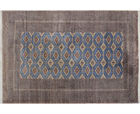 A Bokhara wool carpet, with geometric pattern on blue ground, very good condition. C1980s, 187x280cm