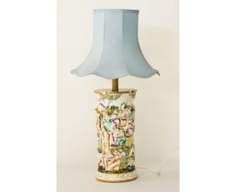 An Italian Capodimonte - FEBLAND faience table lamp, cylindrical shape decorated with high relief figures and foliage, hand p