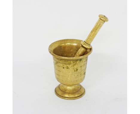 A vintage brass pestle and mortar / grinder, early to mid 20th century. Mortar H13cm, Pestle L20cm. (2)