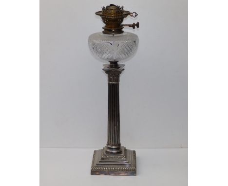 A Victorian oil lamp by Hicks &amp; Sons with cut glass reservoir on EP Corinthian column standard by Goldsmiths, 21.5" overa