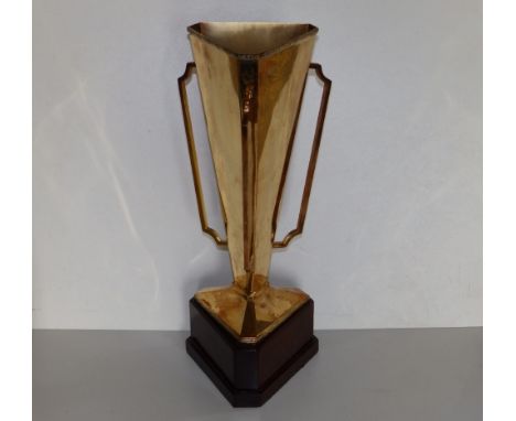 A modern Irish silver-gilt horse racing trophy in the art deco style, of plain tapering triangular section with three handles