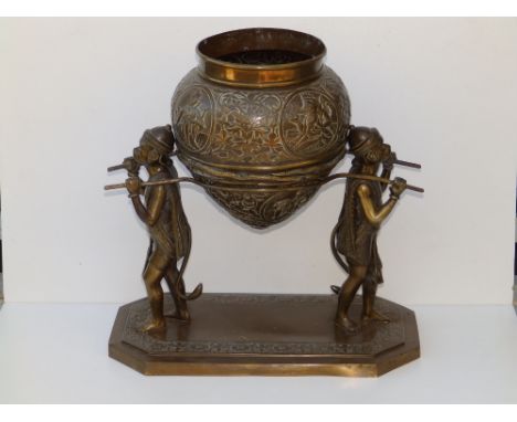 A 19thC Lankan bronze censer being carried by monkeys, the detachable censer of pot-bellied form, decorated with roundels dep