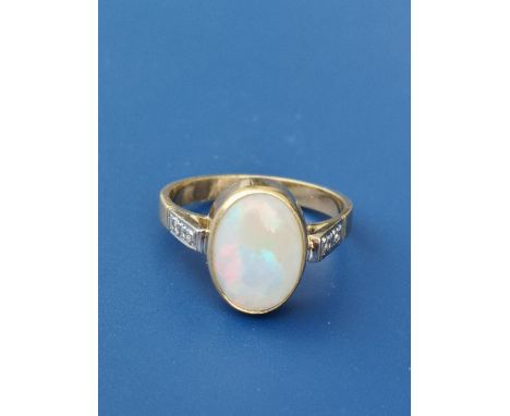 An opal &amp; diamond set 750 yellow metal ring.  Finger size N/O.