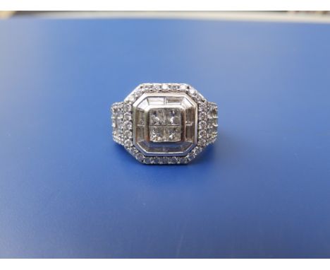 A modern illusion set diamond ring , the setting of square design with canted corners, total diamond weight approximately 2.4