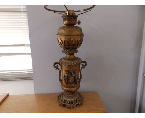 A 19thC continental gilt metal oil lamp, 22".