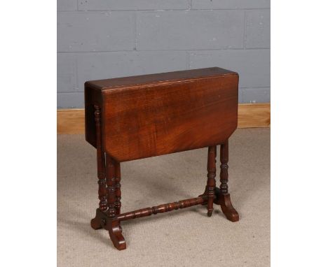 Late Victorian mahogany sutherland table, raised on ring turned legs, 60.5cm high