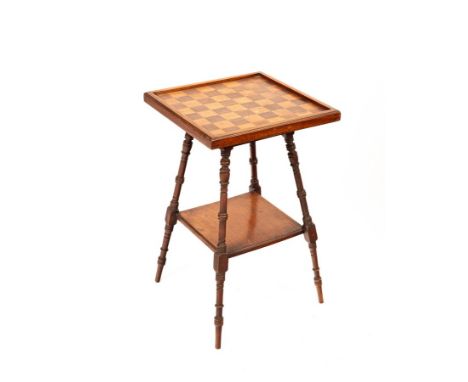 An Edwardian rosewood and beech games table, the top inlaid for chess, the turned legs united by and undertier, 40.5cm wide, 