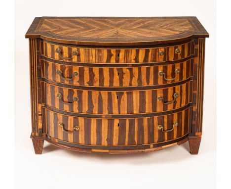 A Dutch laburnum chest of drawers, circa 1800, the quarter veneered and crossbanded top above four long graduated drawers fla