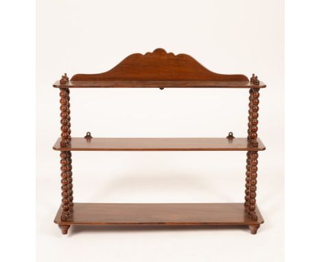 A set of 19th Century wall hanging shelves, the three tiers united by bobbin turned columns, 76.5cm wide, 20cm deep, 65.5cm h