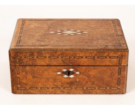 A walnut inlaid box containing turned wooden chess pieces (thirty-two pieces) CONDITION REPORT: King: 10.3cm high, 32 Pieces 
