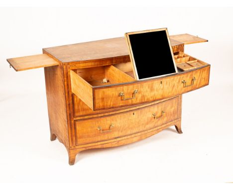 A Regency satin birch bowfront dressing chest of three drawers, the top, pillars and drawer fronts crossbanded in yew wood, t