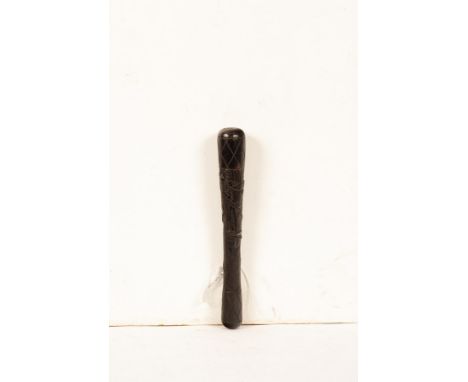 An early 20th Century turned bog oak and carved Irish parish constable truncheon or stave, primitively carved with crossed in