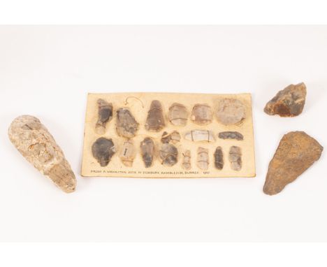 A flint axe head, possibly Neolithic, 13cm long, a flint hand axe, 6cm and a mounted card of flint, possible arrows, labelled